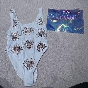 Brand new. Never worn swimsuit.